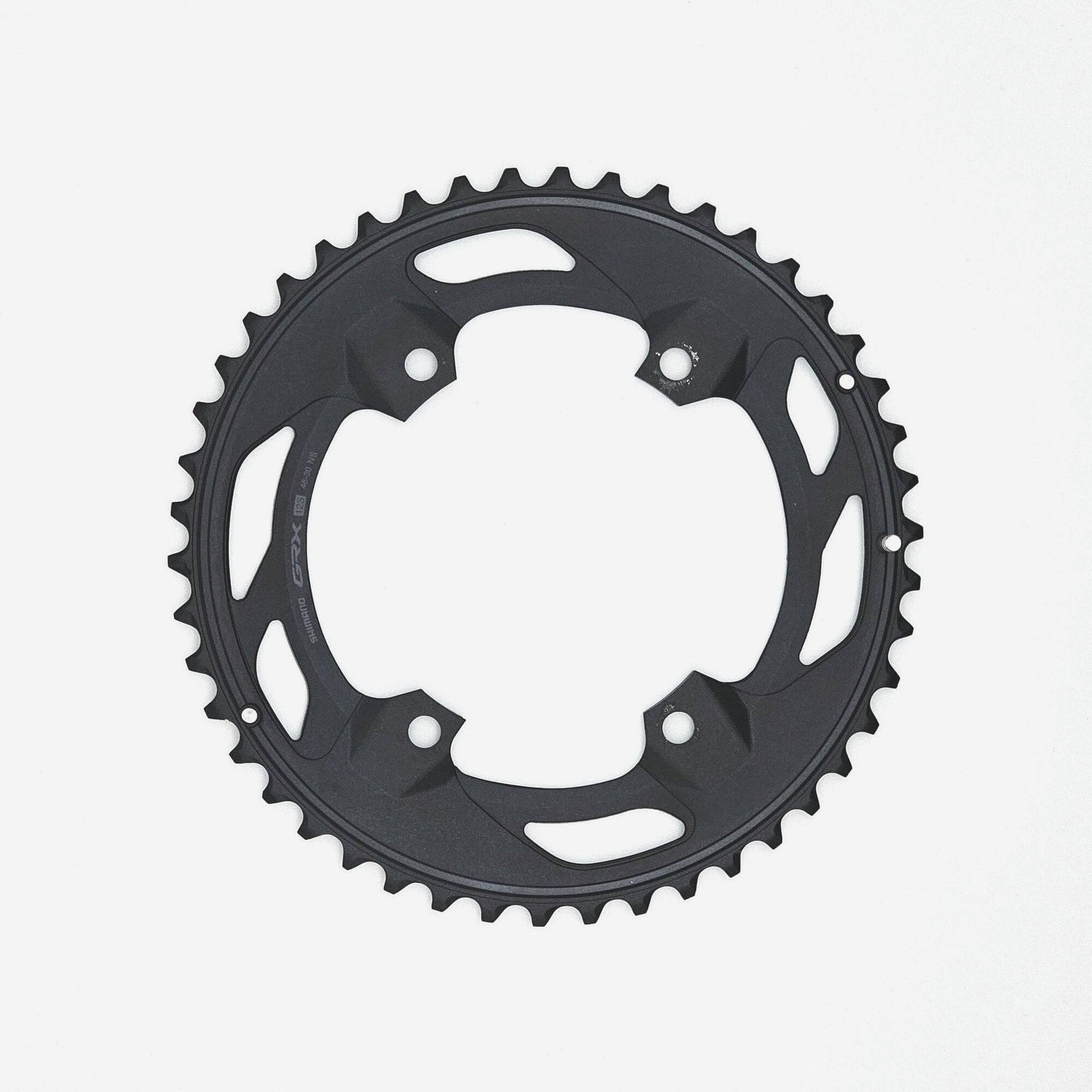 Shimano GRX FC-RX610-2 12-speed double chainring with 46T and 30T for gravel bike components, showing the gear teeth.