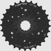 Shimano Tourney CS-HG210 7-speed bike cassette with 12-28T sprockets, showing silver metal gear teeth and branding.