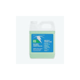 White Lightning Epic Ride synthetic chain lube bottle with bike workshop tools and chain cleaning supplies, long-lasting bike lubricant.