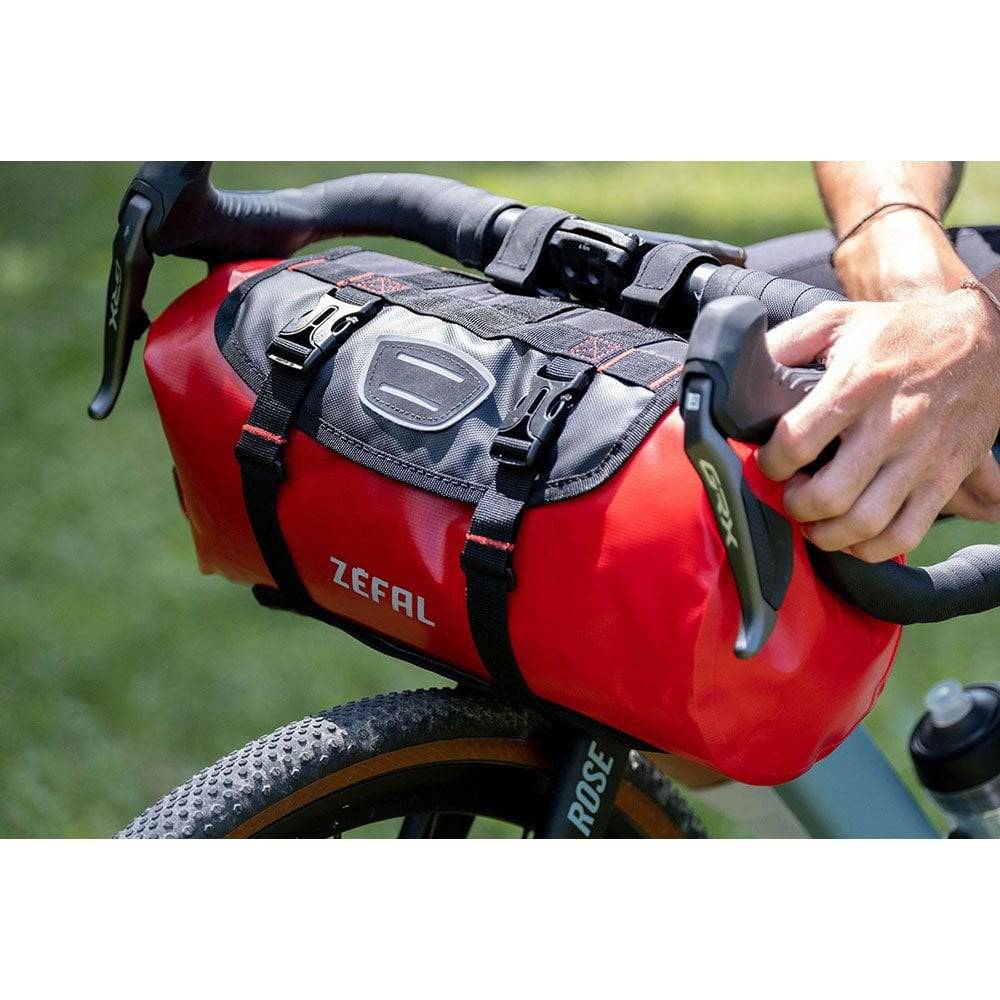 Zefal Z Adventure F10 waterproof bikepacking handlebar bag with 10L capacity, mounted on a bike handlebar for outdoor cycling.