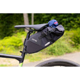 Zefal Z Adventure R5 5L waterproof bikepacking saddle bag attached to bicycle saddle for cycling gear storage.
