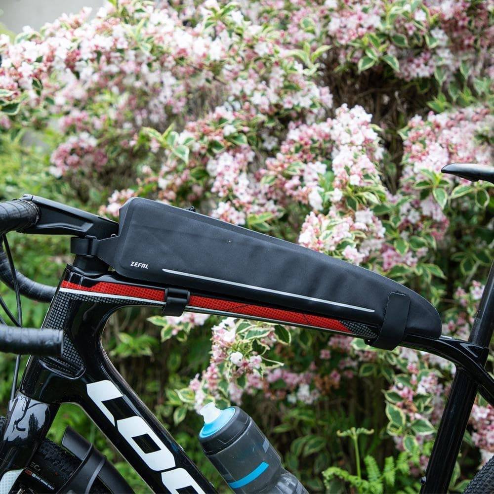 Zefal Z Adventure T3 waterproof top-tube bikepacking bag mounted on a road and MTB bike, designed for durable outdoor cycling accessories.