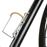 Zefal Vintage bottle cage with leather cover for bikes, featuring a classic design and durable metal construction.