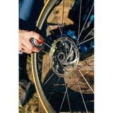 Zefal Disc Brake Cleaner 400ml bottle with spray nozzle, fast-drying degreaser for bike disc brakes in workshop setting