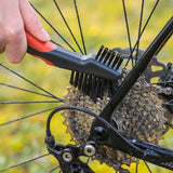 Zefal ZB Brush Set for bike cleaning, including brushes for wheels, chains, and frames, arranged on a workshop surface.
