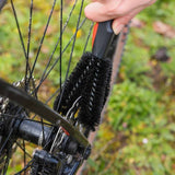Zefal ZB Brush Set for bike cleaning, including brushes for wheels, chains, and frames, shown in a workshop setting.