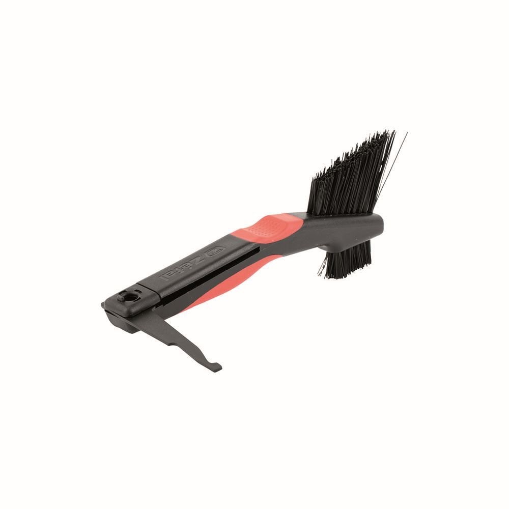 Zefal Clean Brush 3-in-1 bike cleaning tool for chain, freewheel, and derailleur in a workshop setting