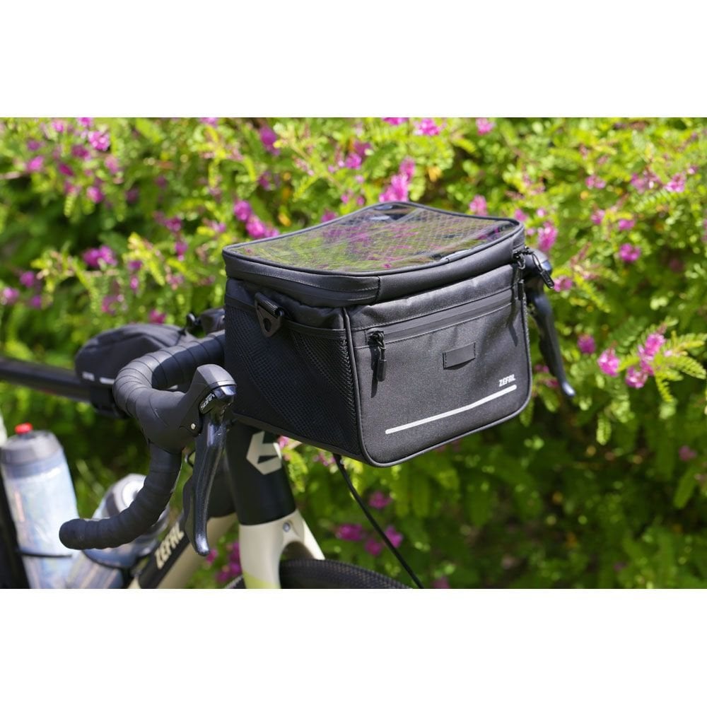 Zefal 7L handlebar bag with universal mount, water-repellent fabric, and rain cover for bike accessories storage.