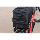 Zefal Z Traveller 40 bike rack bag with waterproof cover and reflective strips, mounted on a bicycle rear rack.