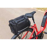 Zefal Z Traveller 60 expandable pannier rack bag with universal mounting system, shown mounted on a bicycle rack.