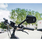 Zefal Espion E80 bike mirror with adjustable handlebar mount on a bicycle handlebar for rearview visibility.