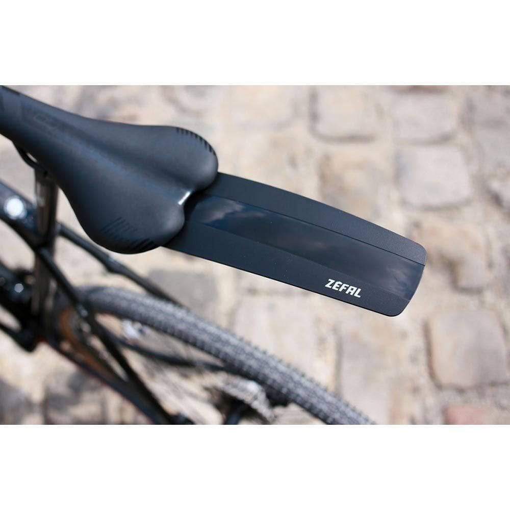 Zefal Shield S10 lightweight road bike mudguard with splash protection, mounted on a bike wheel for off-road riding.
