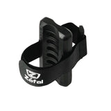 Zefal universal bike pump clip mount attached to a bike frame for secure attachment of bike accessories and pump.