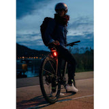 Zefal Vision R20 rear bike light with USB-C charging, four modes, waterproof design, mounted on a bicycle for visibility.