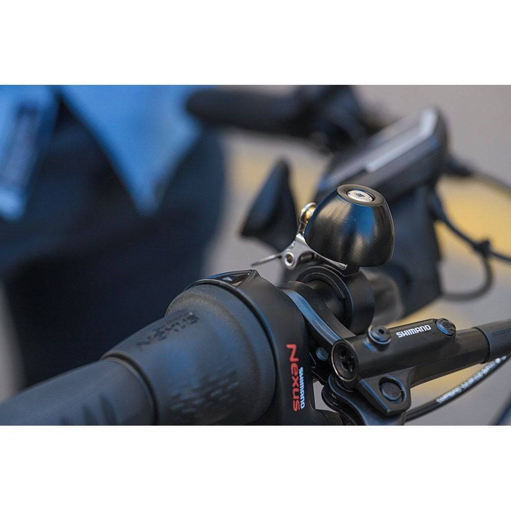 Zefal Classic Brass Bike Bell with loud sound and easy installation, mounted on bicycle handlebar for accessories.