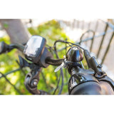 Zefal Classic Brass Bike Bell with loud sound and easy installation, mounted on a bicycle handlebar for cycling safety.