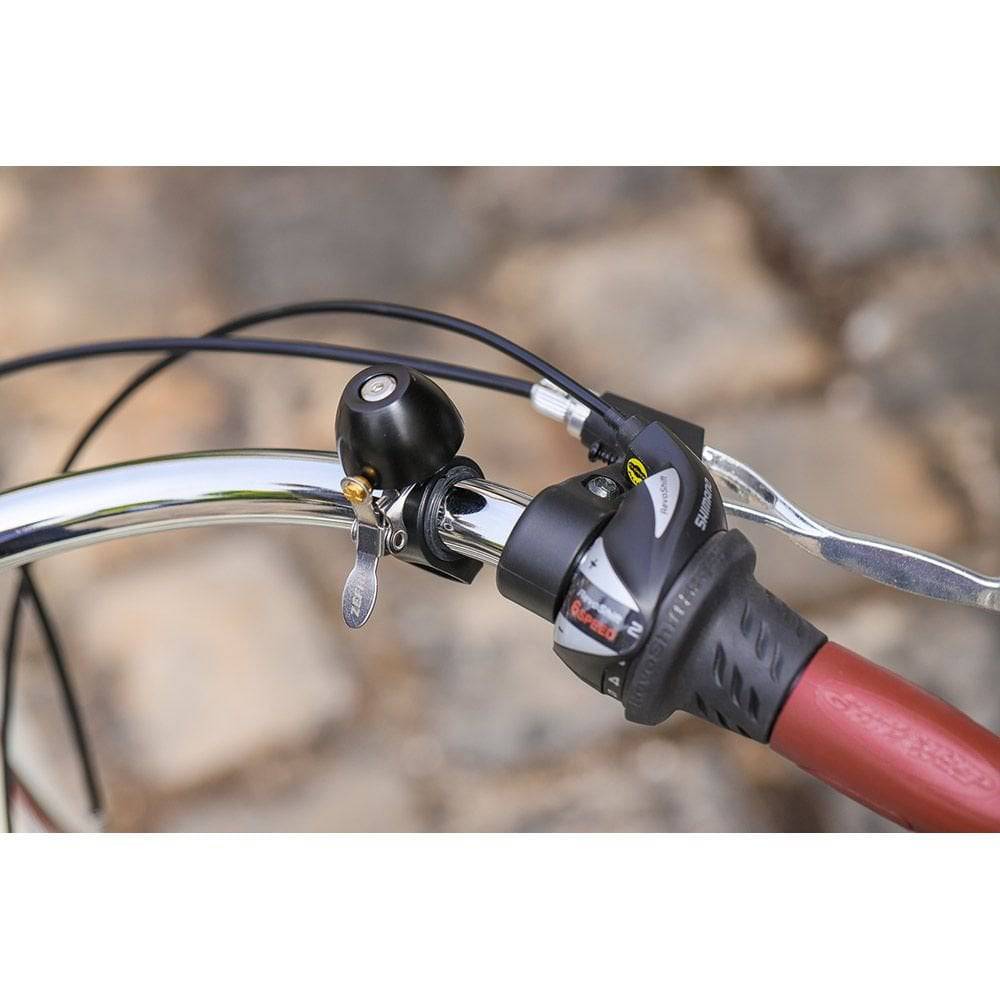 Zefal Classic Brass Bike Bell with loud sound and easy installation, mounted on a bicycle handlebar.