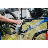 Zefal eco-friendly bike cleaner and shampoo in a workshop setting, with sprayer and cleaning kit components visible.