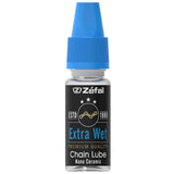 Zefal Extra Wet Lube ceramic bike chain lubricant for all weather conditions, shown in a workshop setting