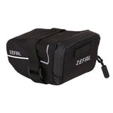 Zefal Z Light saddle packs with reflective stripes and light mount, bike seat storage accessory for cycling enthusiasts.