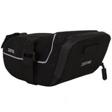 Zefal Z Light saddle pack with reflective stripes and light mount attached to a bike seat for storage and visibility.