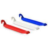 Zefal DP20 durable resin bike tyre levers set of 3 for easy tyre removal, shown in a workshop setting.