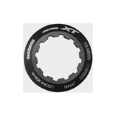 Shimano CS-M8000 lock ring and spacer components for cassette maintenance, shown on a white background.