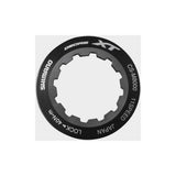 Shimano CS-M8000 lock ring and spacer components for cassette maintenance, shown on a white background.