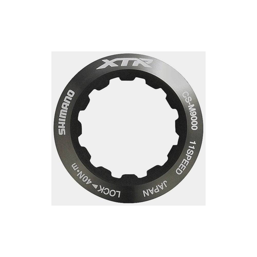 Shimano CS-M9000 lock-ring and spacer set for cassette installation, genuine Shimano components for bike drivetrain maintenance.