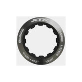 Shimano CS-M9000 lock-ring and spacer set for cassette installation, genuine Shimano components for bike drivetrain maintenance.