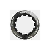 Shimano CS-M9000 lock-ring and spacer set for cassette installation, genuine Shimano components for bike drivetrain maintenance.