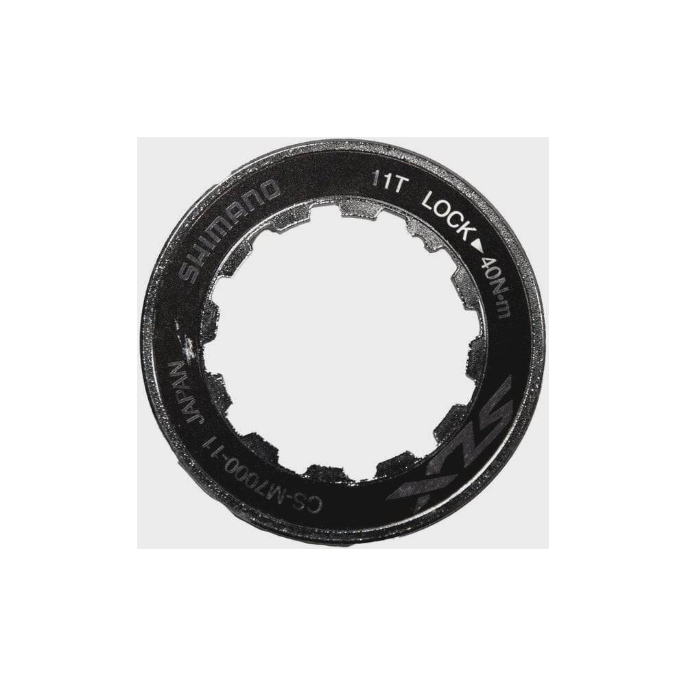Shimano CS-M7000 lock ring and spacer components for cassette, genuine replacement parts, black metal, shown on white background.
