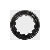 Shimano CS-M7000 lock ring and spacer components for cassette, genuine replacement parts, black metal, shown on white background.