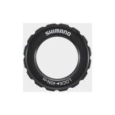 Shimano Spares HB-M618 lock ring and washer for hub assembly maintenance, close-up of bicycle component parts.