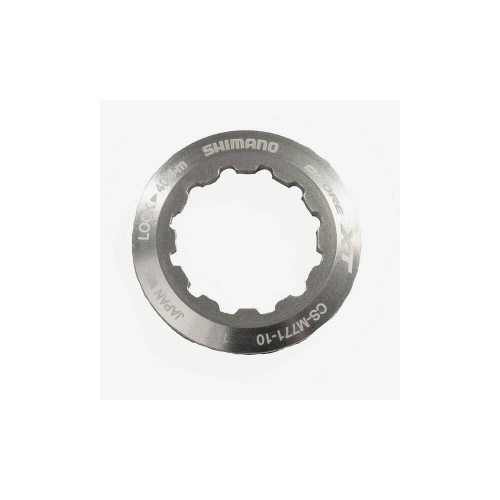 Shimano CS-M771 lock ring and spacer for secure cassette installation on bicycle wheel hub components.