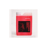 Shimano Mineral Oil Hydraulic Brake Fluid 1 Litre in red for disc brakes, shown in a workshop setting