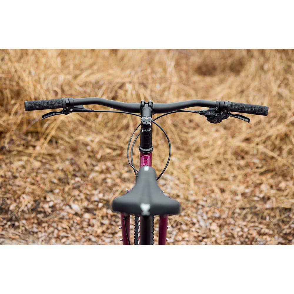 Surly Ogre chromoly steel mountain bike frame with sleek black finish, designed for commuting and trail riding.