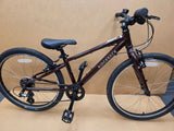 Ridgeback Kids Dimension 24-inch children's bike with blue frame and training wheels, ready for young riders.