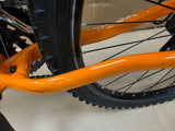 Ridgeback Kids MX26 demo bike with a durable 26-inch frame, suitable for children, shown outdoors with a colorful design.
