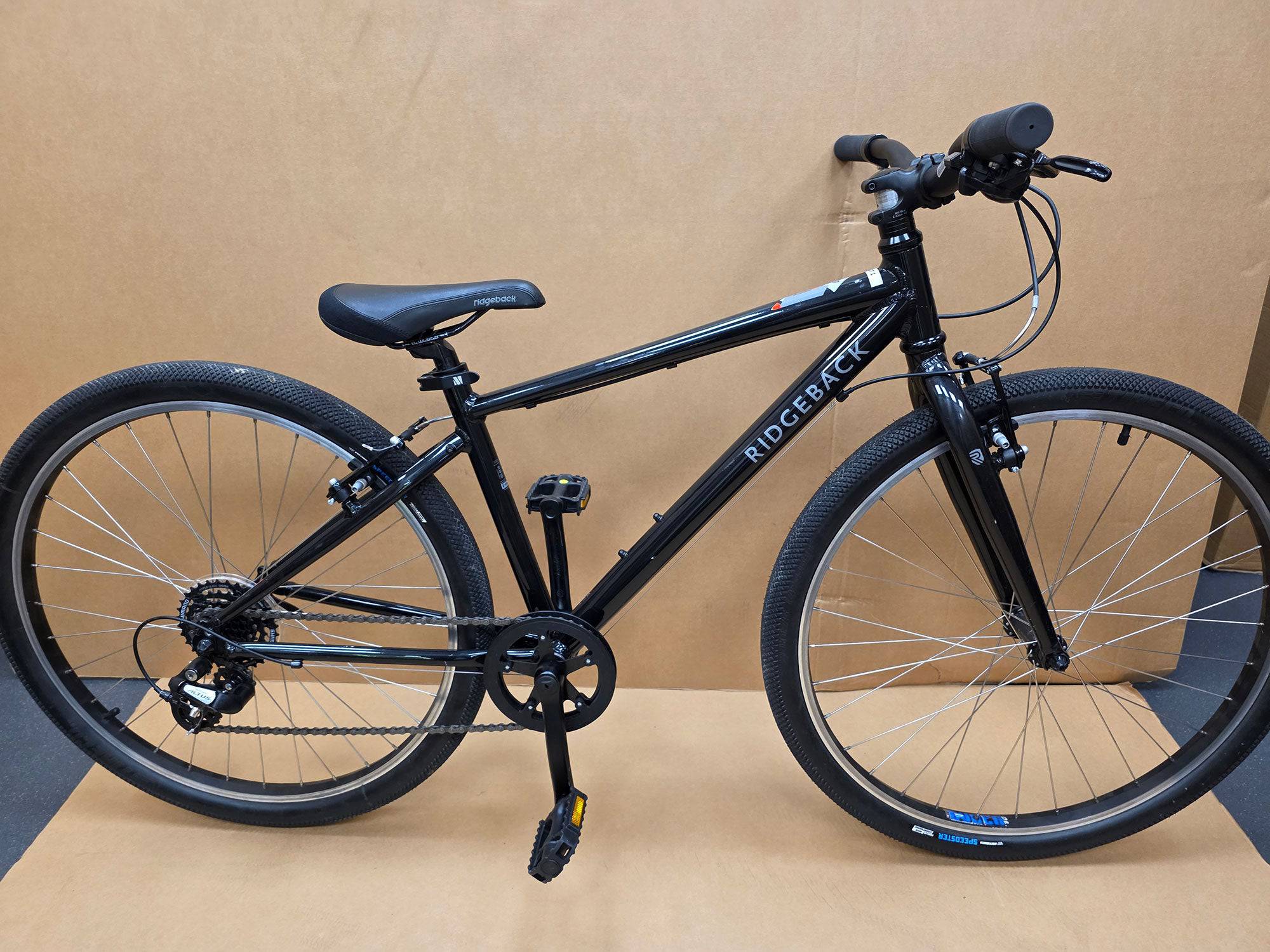 Ridgeback Kids Dimension 26 grey bike for young riders, featuring a sturdy frame and reliable design, suitable for children.
