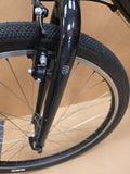 Ridgeback Kids Dimension 26 grey bike for young riders, showing sturdy frame and 26-inch wheels for kids' cycling adventures.