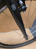 Ridgeback Kids Dimension 26 Grey bike for young riders, featuring a durable frame and reliable design, shown from side view.