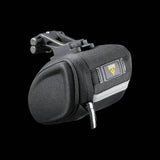 Topeak Sidekick Wedge Pack bike seat bag with semi-rigid design and reflective strip, mounted under bike saddle for accessories.