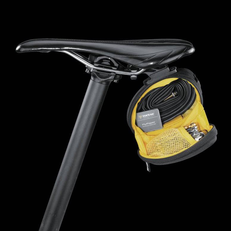 Topeak Sidekick Wedge Pack bike seat bag with semi-rigid design and reflective strip, mounted under bike saddle.