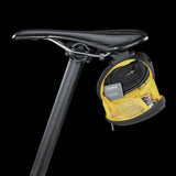Topeak Sidekick Wedge Pack bike seat bag with semi-rigid design and reflective strip, mounted under bike saddle.