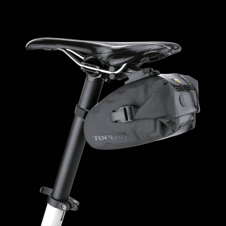 Topeak Drybag Wedge QuickClick waterproof bike seat pack with tail light strap attached, designed for cycling accessories.