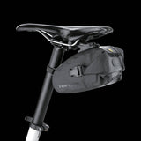 Topeak Drybag Wedge QuickClick waterproof bike seat pack with tail light strap attached, designed for cycling accessories.
