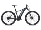 Giant Talon E+ 29 3 electric mountain bike with pedal-assist, black frame, and knobby tires suitable for trail riding.
