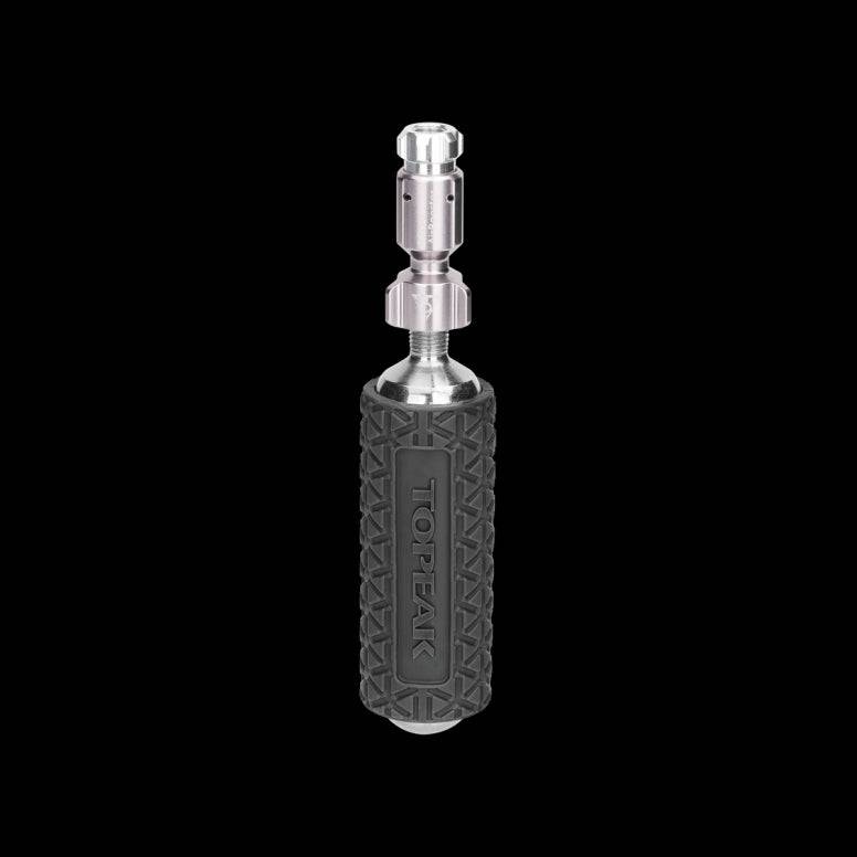 Topeak Micro Airbooster CO2 inflator with cartridge, compatible with Presta and Schrader valves, for bike tire inflation accessories.