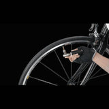 Topeak AirBooster Compact CO2 inflator with dust cap, compatible with Presta and Schrader valves, shown in close-up.